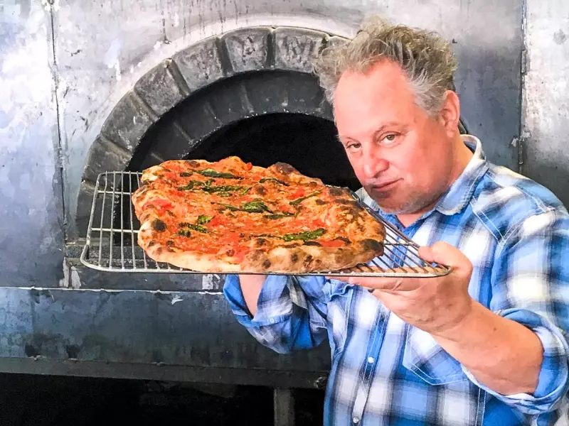 Chef Chris Bianco serving up a slice.