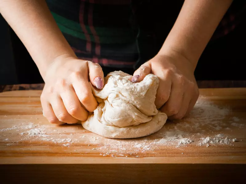 Kneading the pizza dough is one of the most important steps in the process.